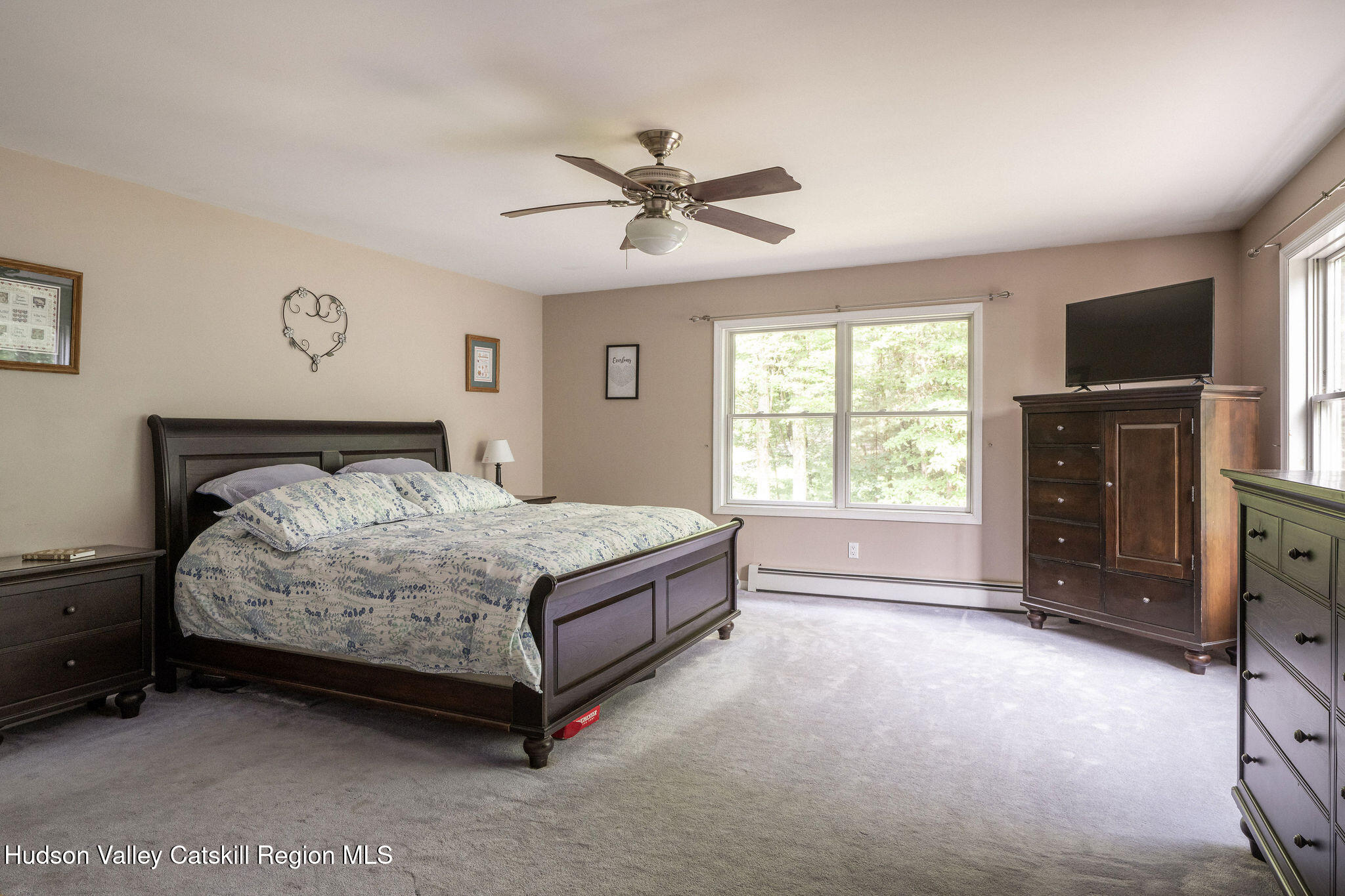 214 Wright Road Kerhonkson, NY 12446 - Photo 33 of 50 a bedroom with a bed and a flat tv screen on dresser