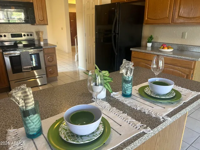 a bathroom with a granite countertop sink toilet and a shower