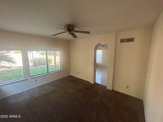 a kitchen with stainless steel appliances granite countertop a refrigerator a stove and a sink