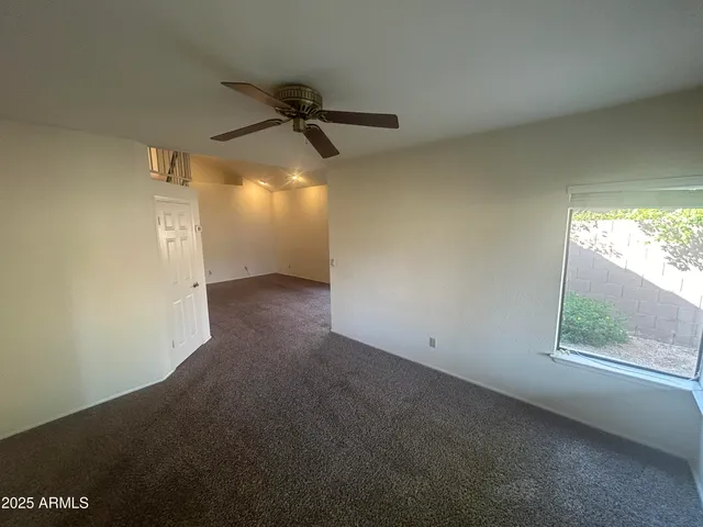 a kitchen with a stove and a wooden floor