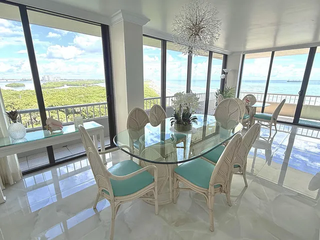 a view of a balcony with a table and chairs