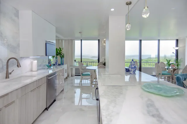 a kitchen with stainless steel appliances a sink and a microwave