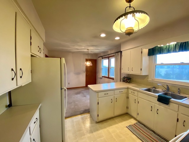 3871 Shutterlee Mill Road Staunton, VA 24401 - Photo 8 of 28 a kitchen with stainless steel appliances a stove a sink a refrigerator and cabinets