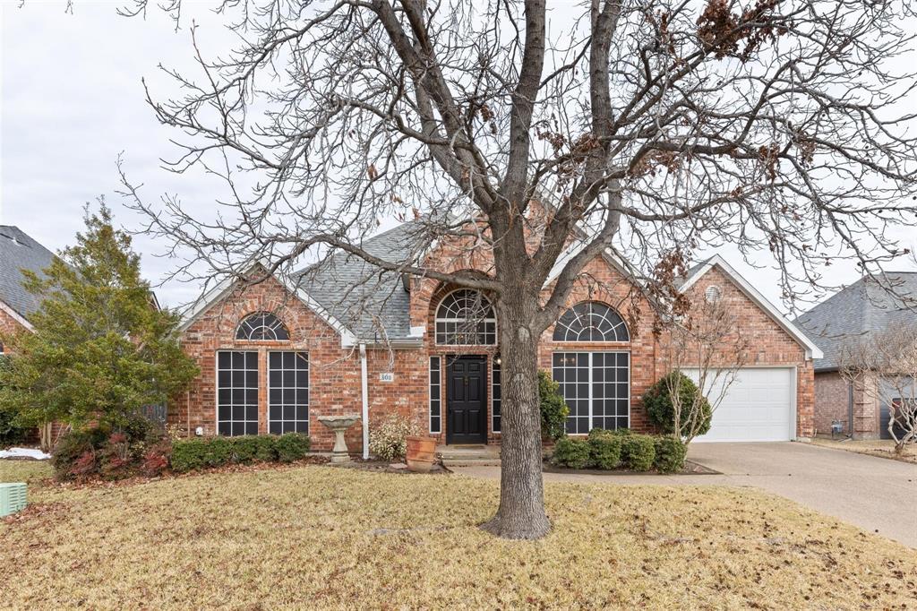803 Harvest Drive McKinney, TX 75072 - Photo 1 of 1 a front view of a house with a yard and garage