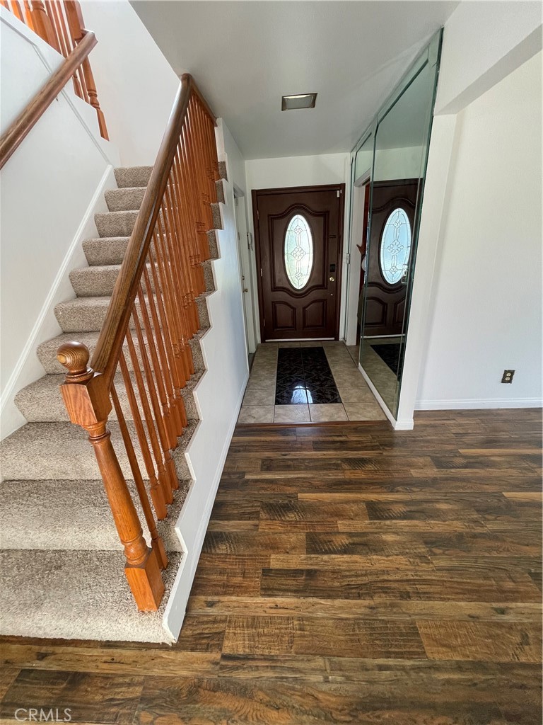 19426 Belshaw Avenue Carson, CA 90746 - Photo 7 of 19 a view of entryway wooden floor and staircase