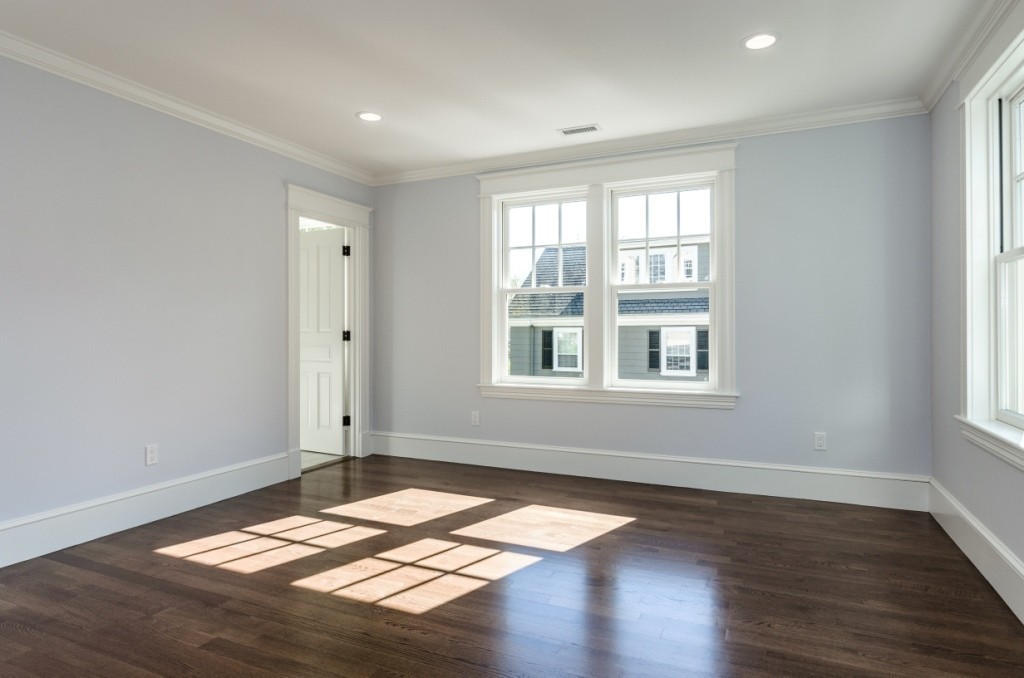 26 Slocum Road Lexington, MA 02421 - Photo 17 of 21 an empty room with wooden floor and windows