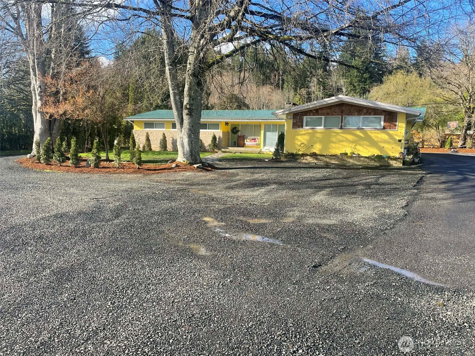 310 West Pine Street Elma, WA 98541 - Photo 1 of 4 a view of a house with a yard and large tree