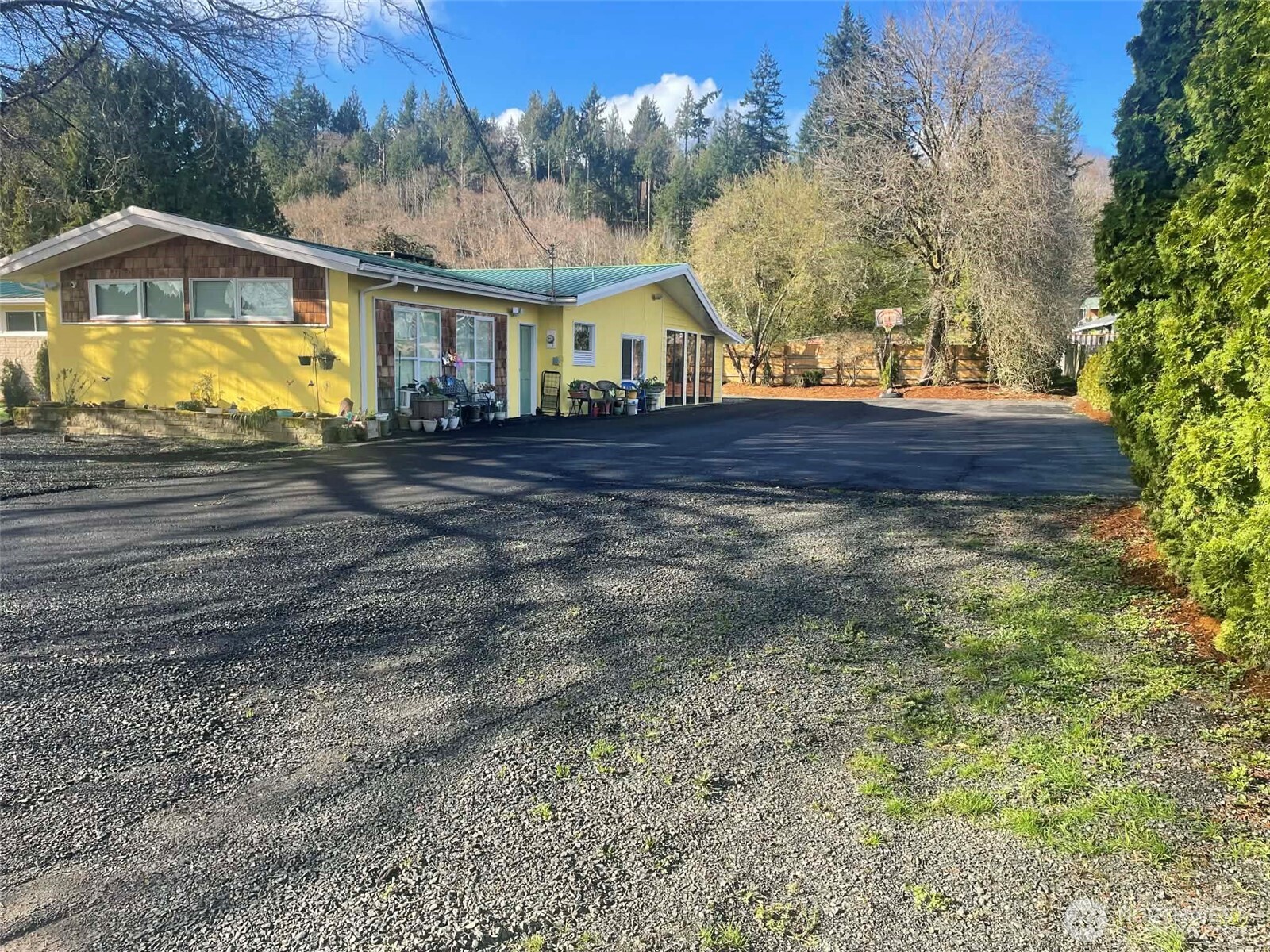 310 West Pine Street Elma, WA 98541 - Photo 4 of 4 a view of house with yard and swimming pool