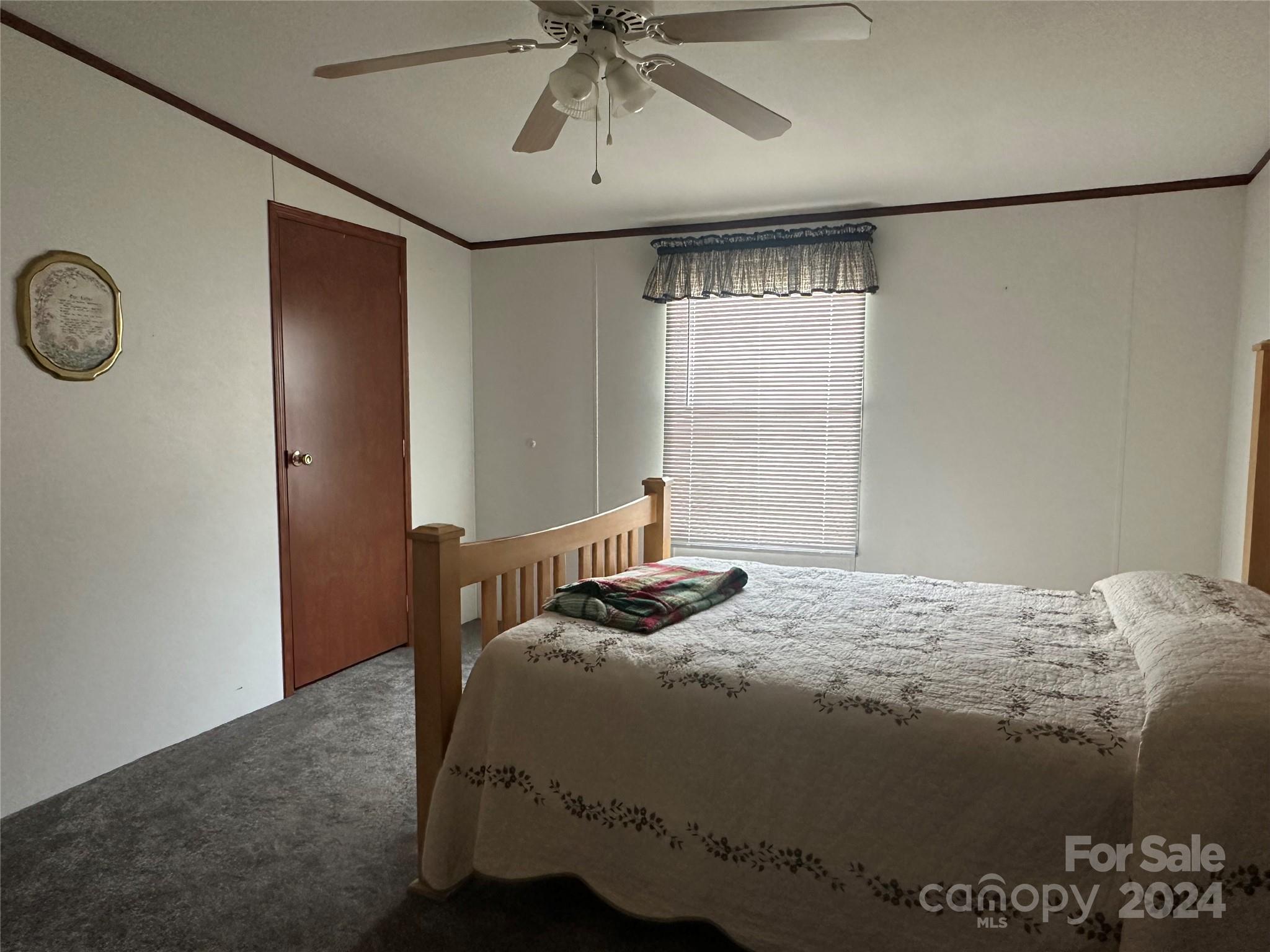 7014 Riverbend Road Claremont, NC 28610 - Photo 16 of 21 a bedroom with a bed and window