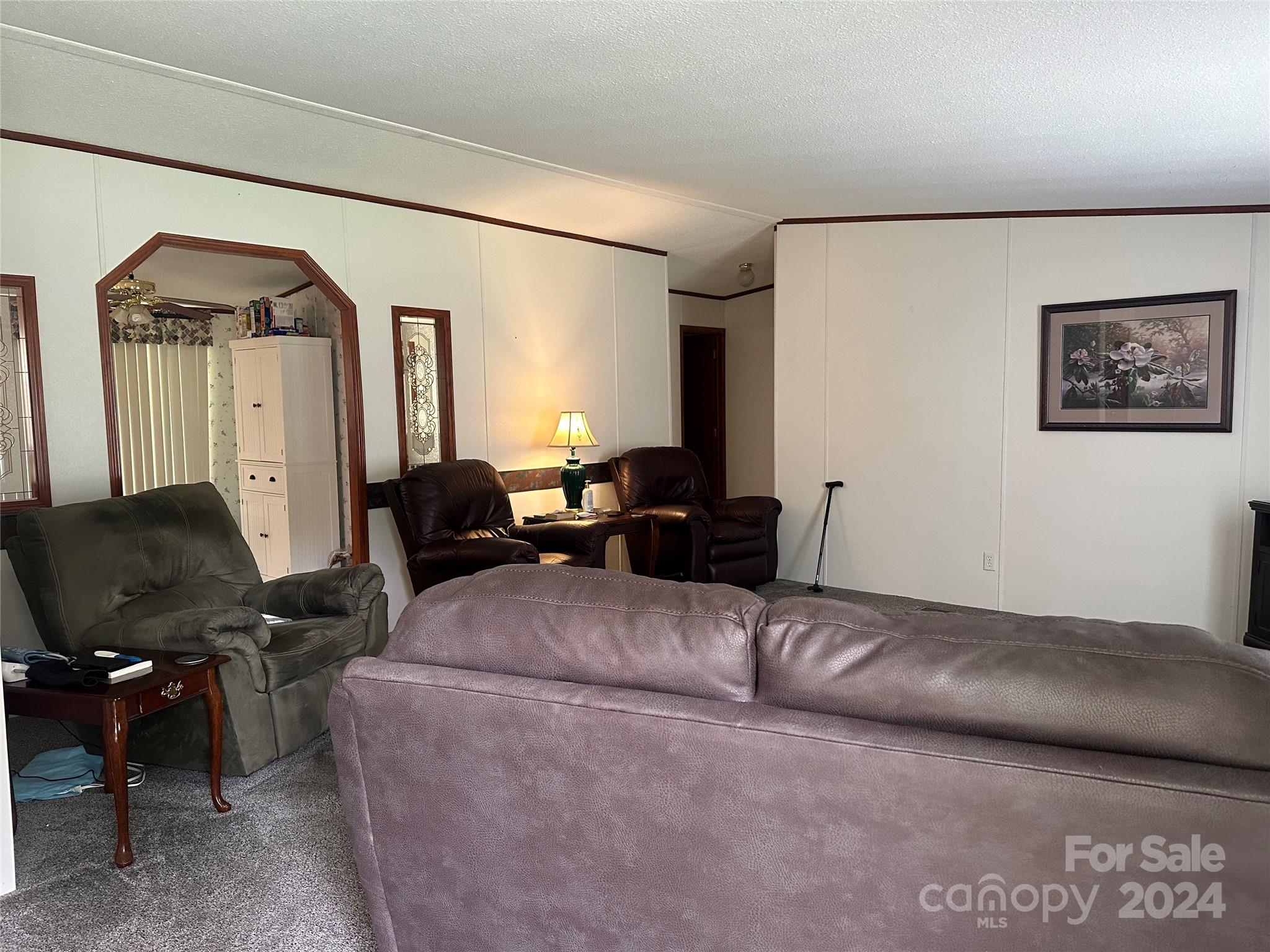 7014 Riverbend Road Claremont, NC 28610 - Photo 2 of 21 a living room with furniture and a window