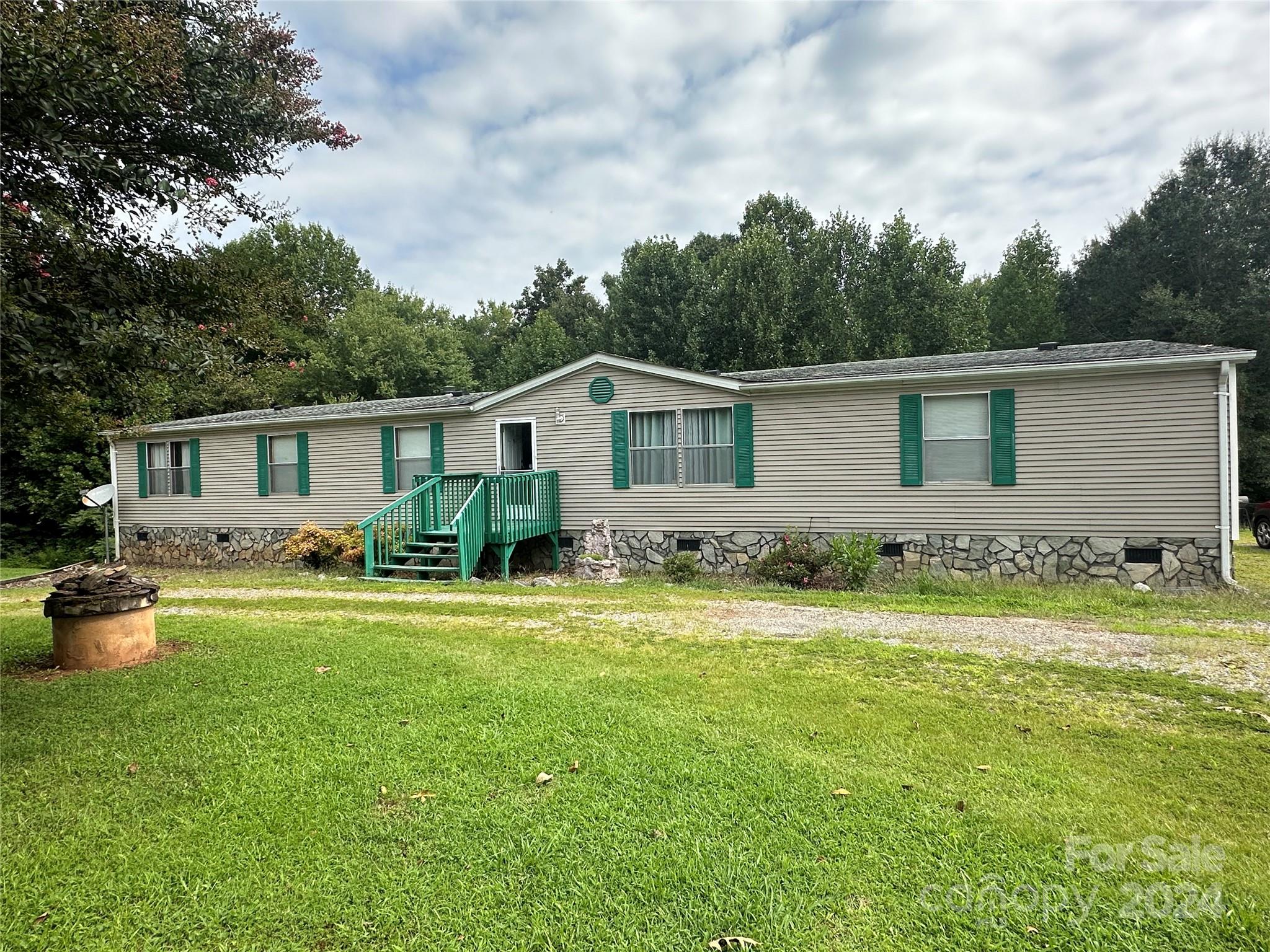 7014 Riverbend Road Claremont, NC 28610 - Photo 21 of 21 a front view of house with yard and green space