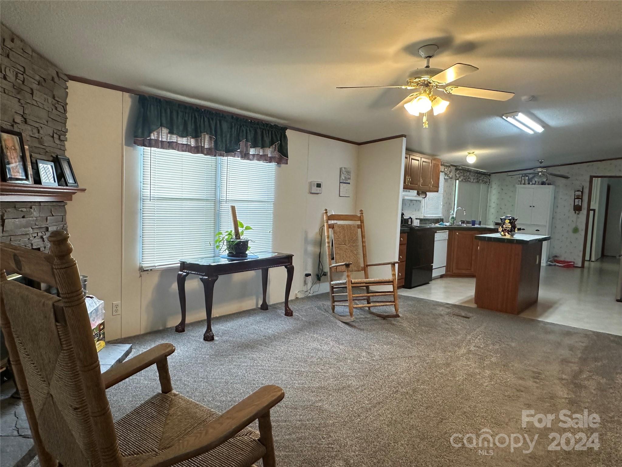 7014 Riverbend Road Claremont, NC 28610 - Photo 10 of 21 a view of a livingroom with furniture and a piano