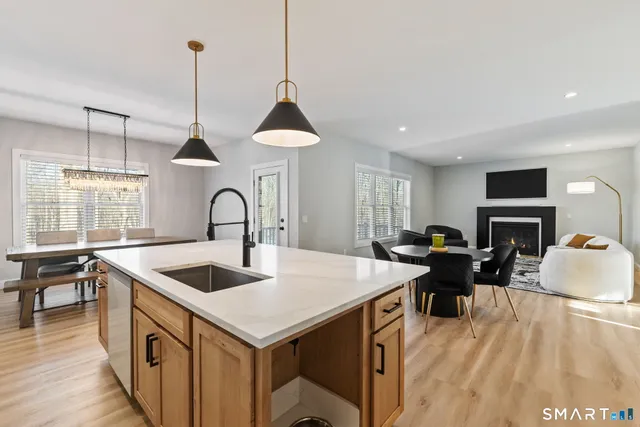 a view of a dining room with furniture and a fire place
