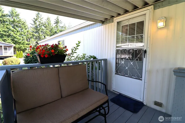 a living room with furniture window and wooden floor