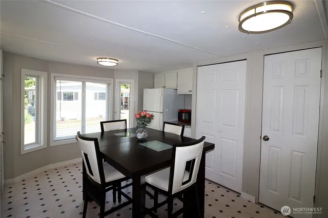 a dining room with furniture and window