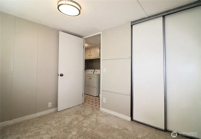 a view of cabinets and refrigerator