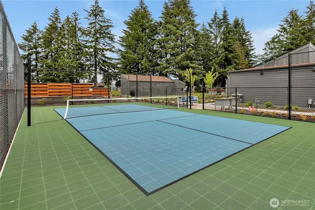a backyard of apartments with large trees