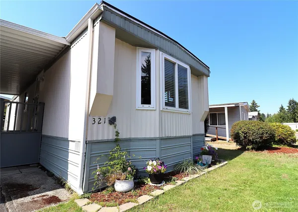 a front view of a house with garden