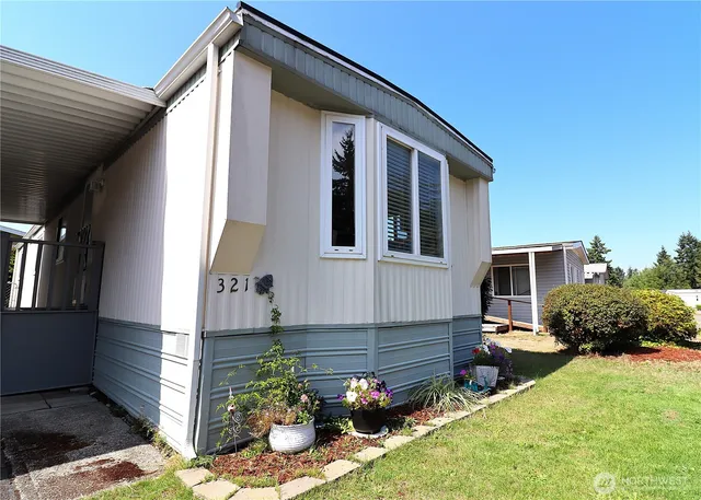 a front view of a house with garden