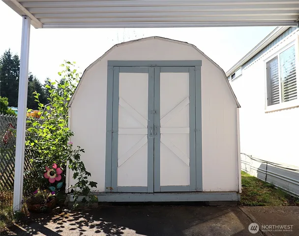 a view of a house with a flower garden