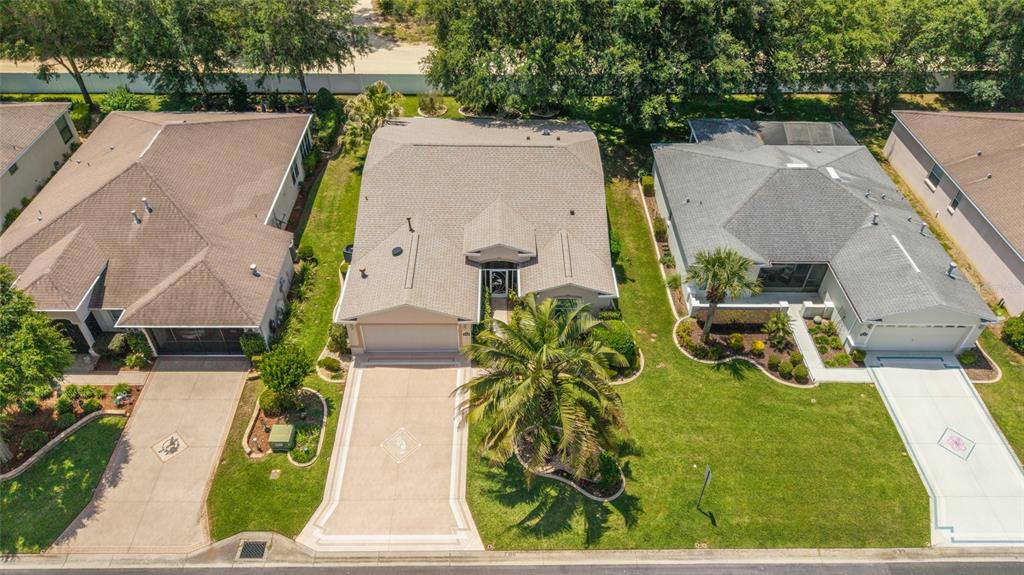 16369 Southwest 14th Avenue Road Ocala, FL 34473 - Photo 49 of 49 an aerial view of a house with garden space and a patio