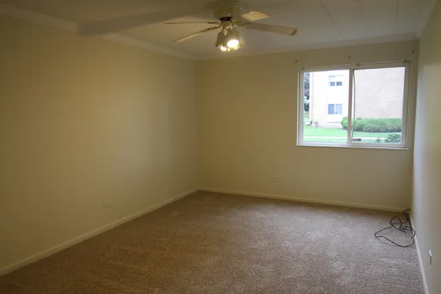 a view of an empty room and closet area
