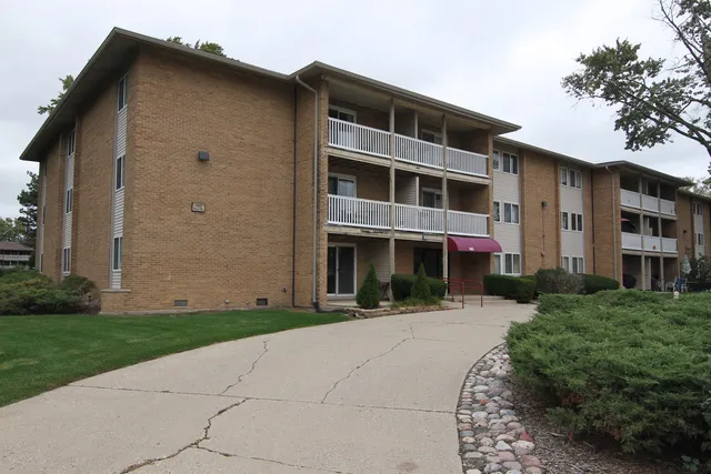 a front view of building with yard
