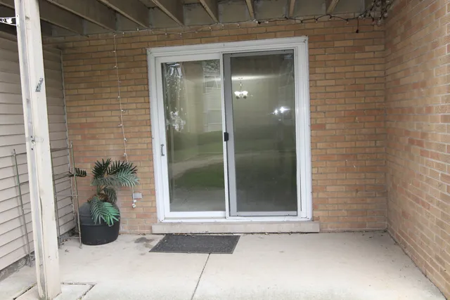 a view of a house with a big yard and large trees