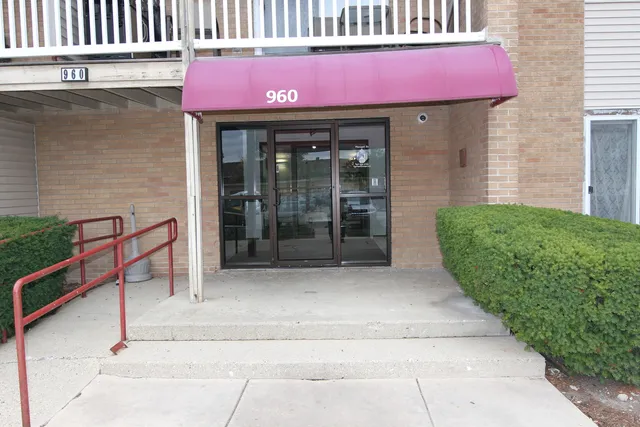 a kitchen with a refrigerator and cabinets