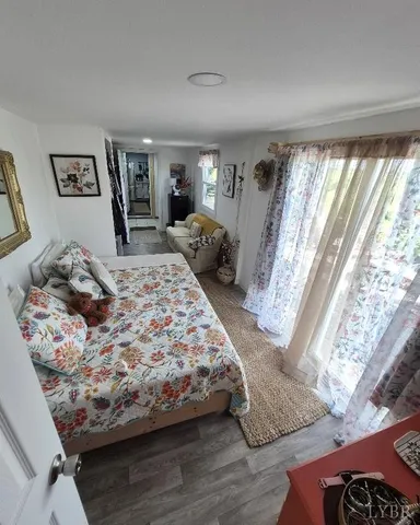 a bedroom with a large bed and a dresser