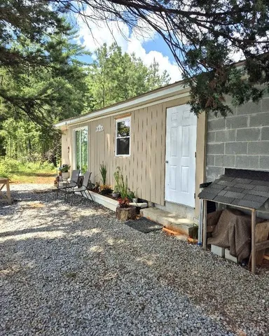 a view of an chairs and table in a garden
