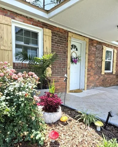a front view of a house with yard