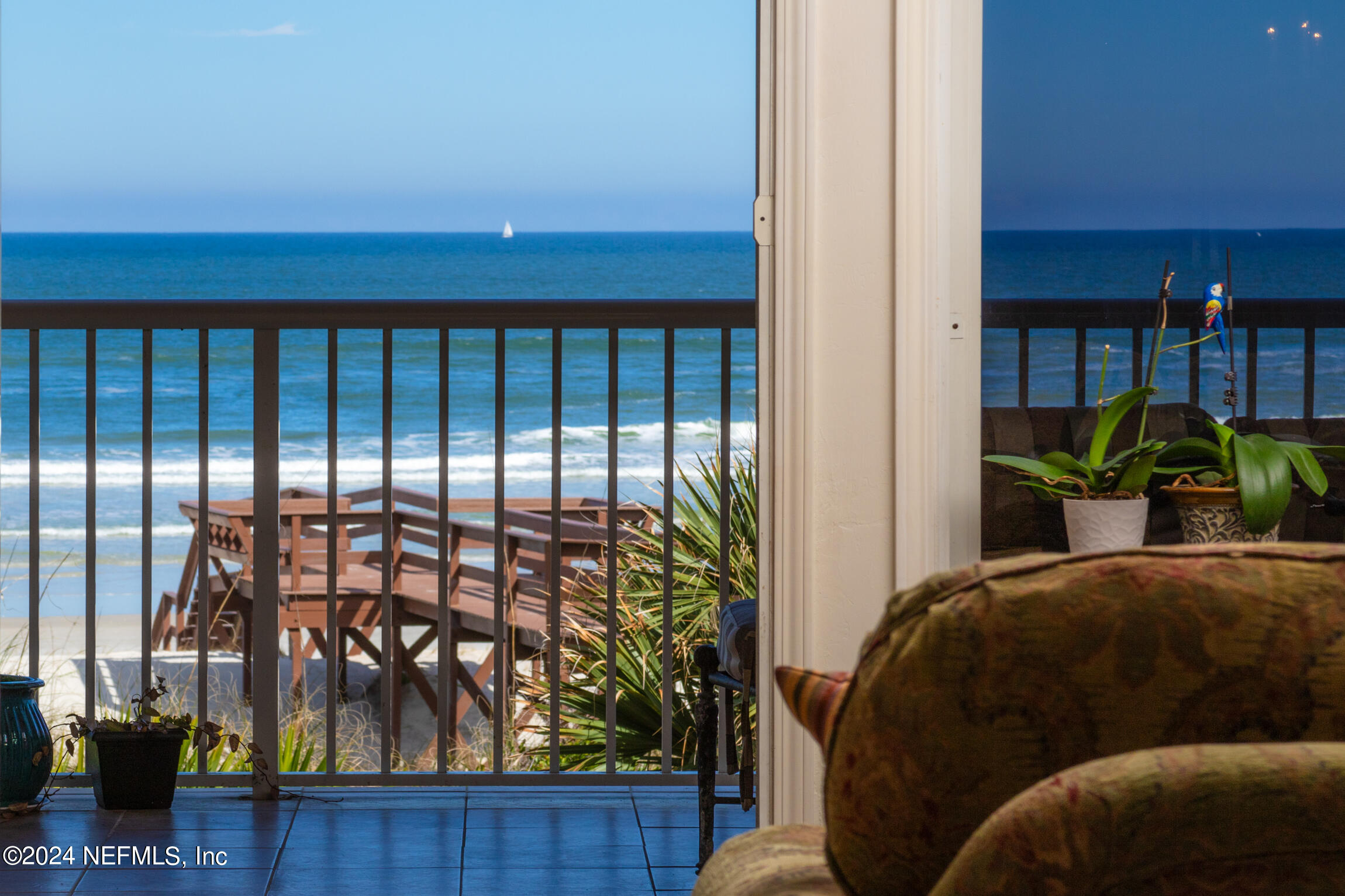 7790 A1A South, Unit 101 St. Augustine, FL 32080 - Photo 13 of 79 a living room filled with furniture and a potted plant