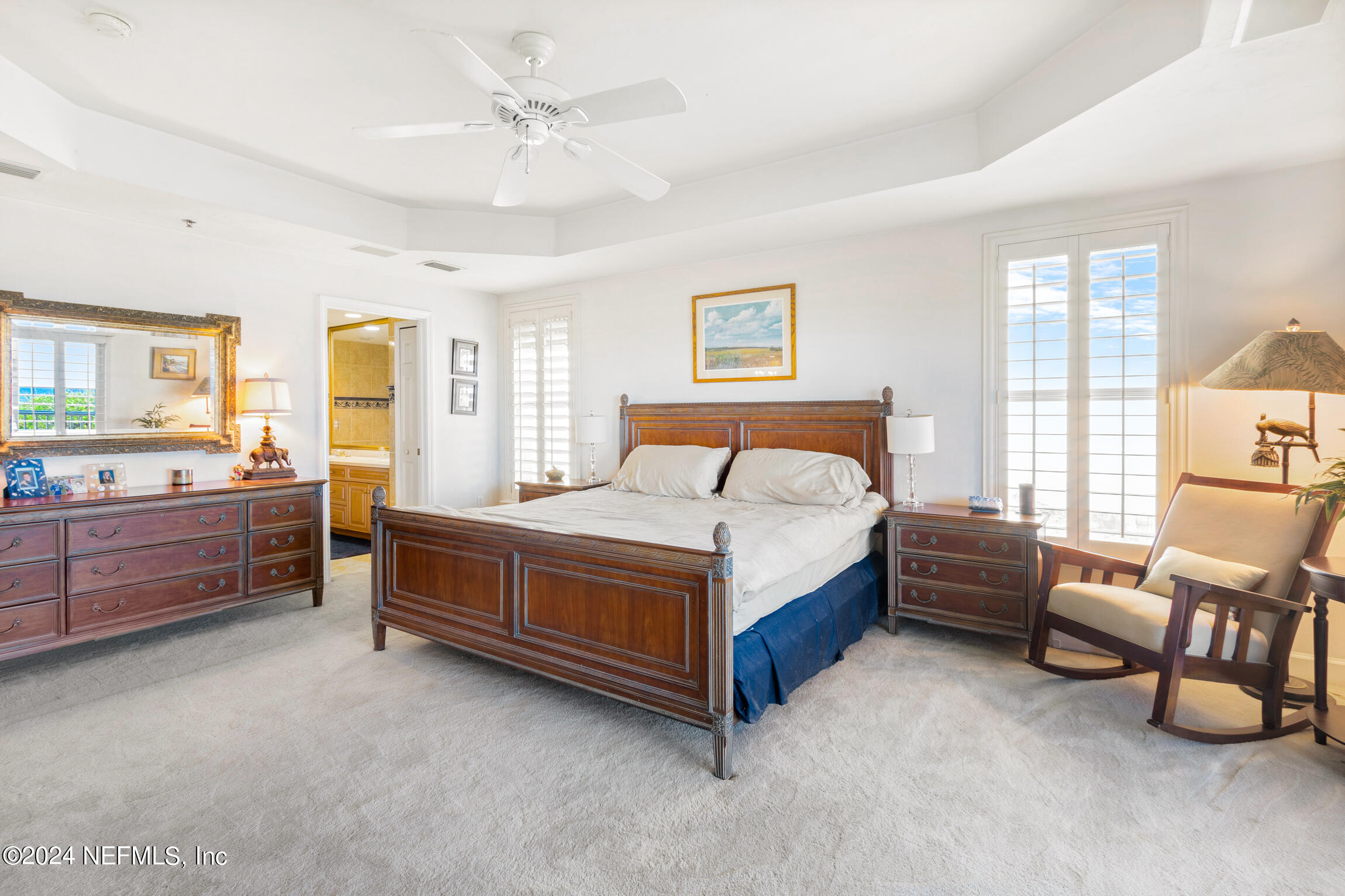 7790 A1A South, Unit 101 St. Augustine, FL 32080 - Photo 22 of 79 a bedroom with a bed and a couch