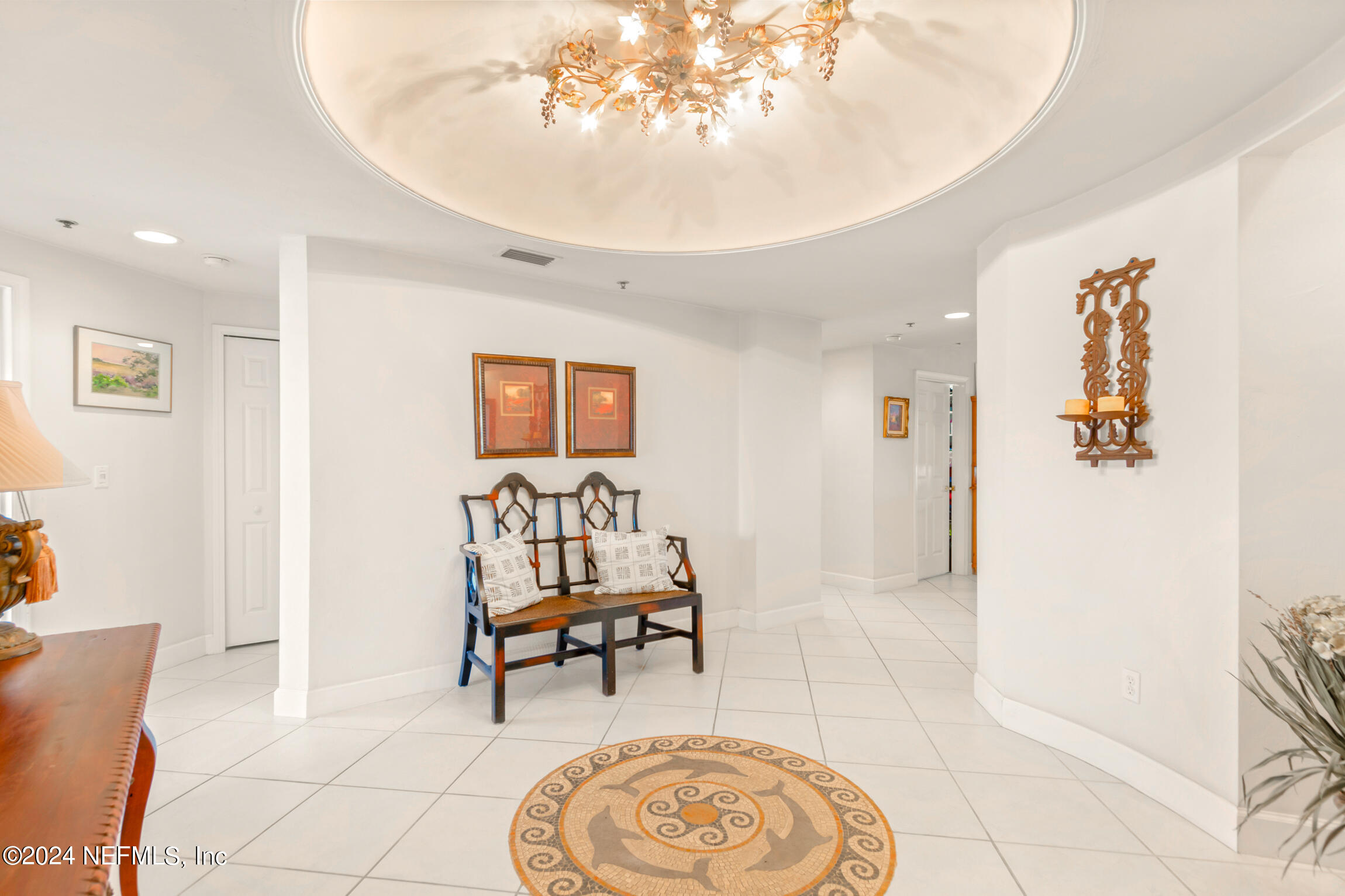 7790 A1A South, Unit 101 St. Augustine, FL 32080 - Photo 26 of 79 a living room with furniture and a painting on the wall