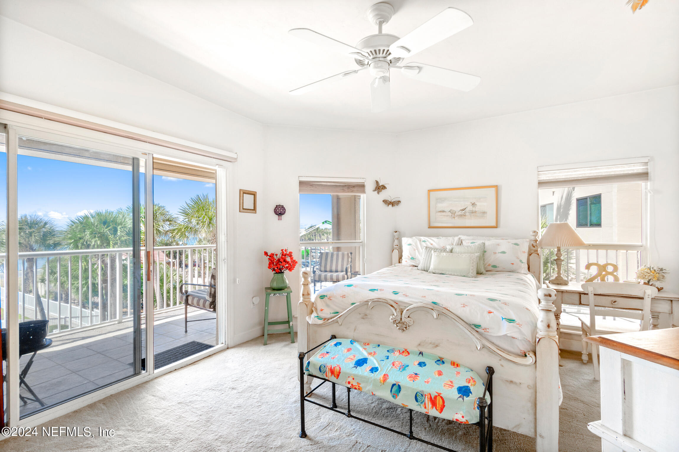 7790 A1A South, Unit 101 St. Augustine, FL 32080 - Photo 28 of 79 a bedroom that has a bed and a window