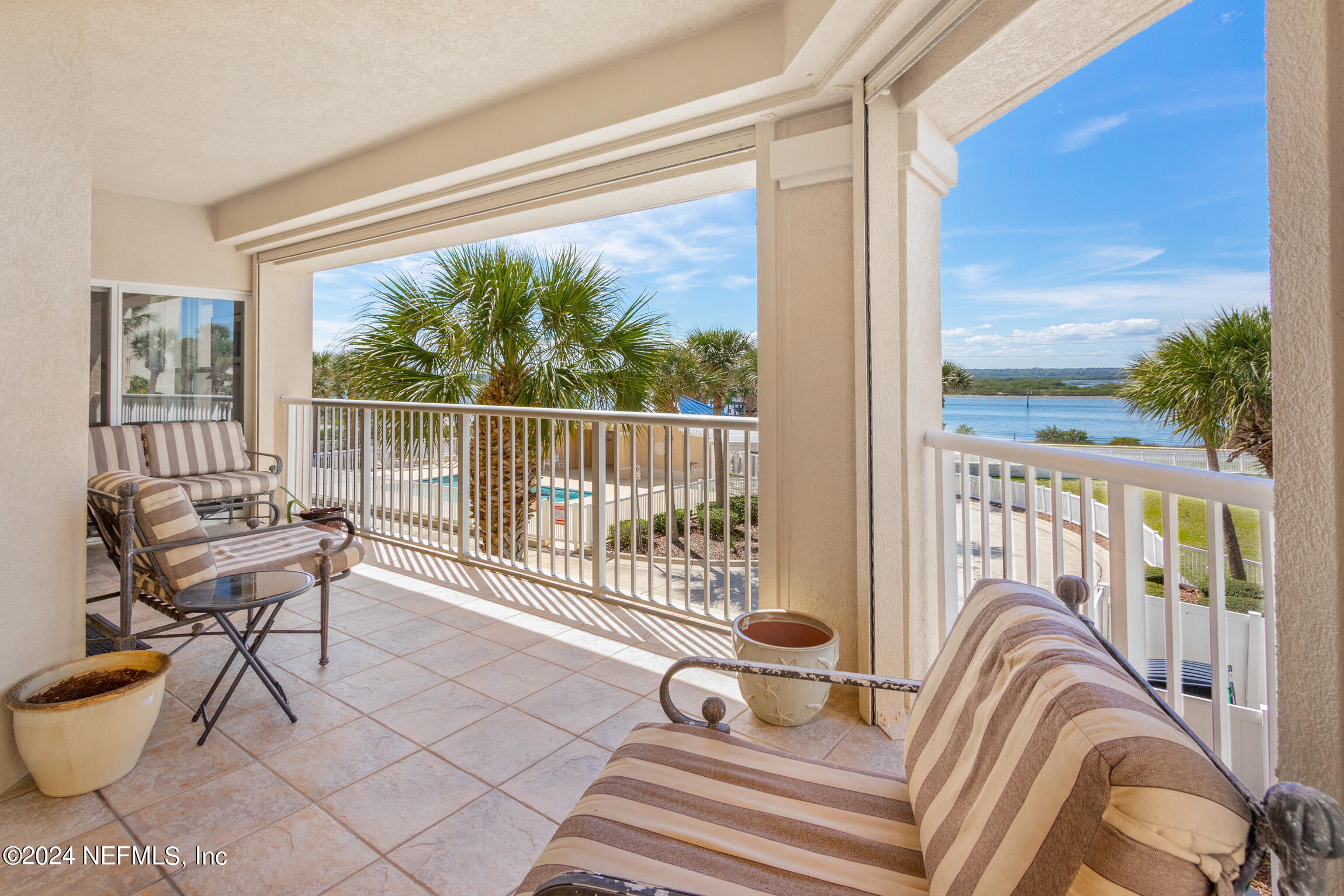 7790 A1A South, Unit 101 St. Augustine, FL 32080 - Photo 29 of 79 a view of a chair and tables front of the house