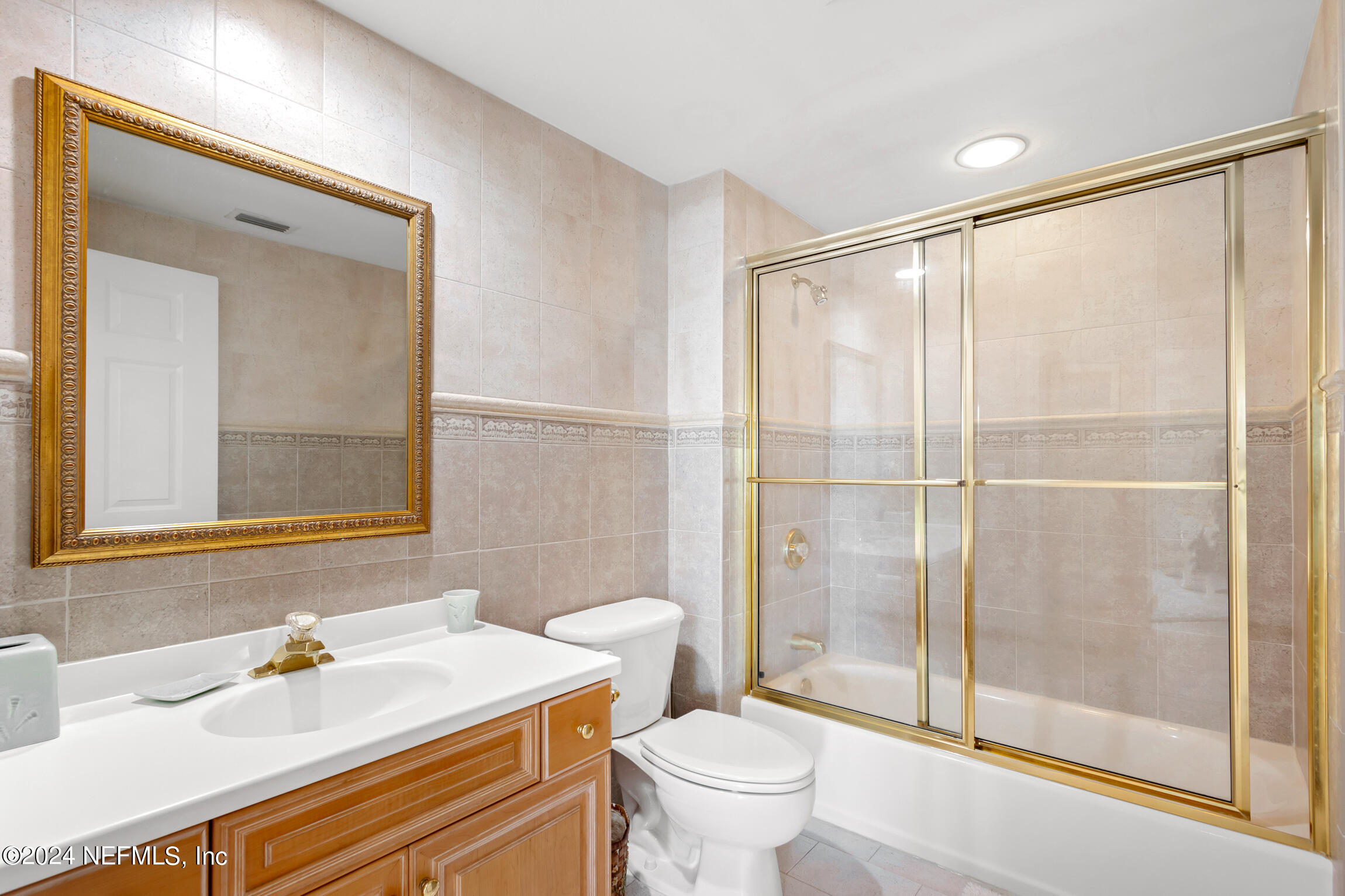 7790 A1A South, Unit 101 St. Augustine, FL 32080 - Photo 37 of 79 a bathroom with a sink toilet and shower