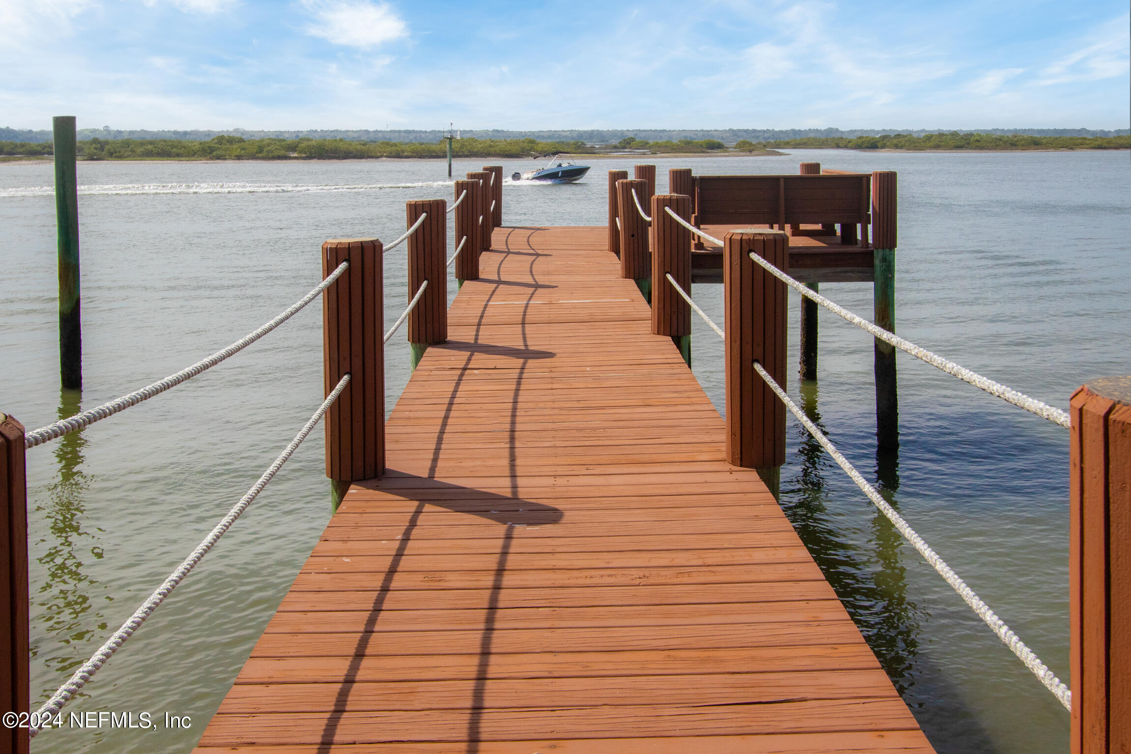 7790 A1A South, Unit 101 St. Augustine, FL 32080 - Photo 56 of 79 a view of balcony with wooden floor and stairs