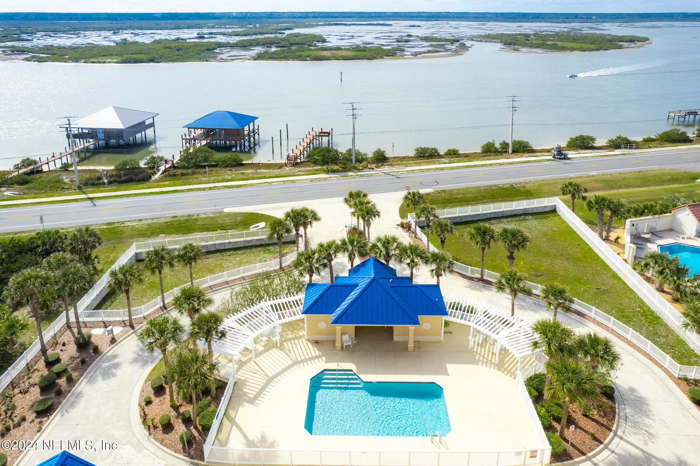 7790 A1A South, Unit 101 St. Augustine, FL 32080 - Photo 68 of 79 a view of a swimming pool and an outdoor seating