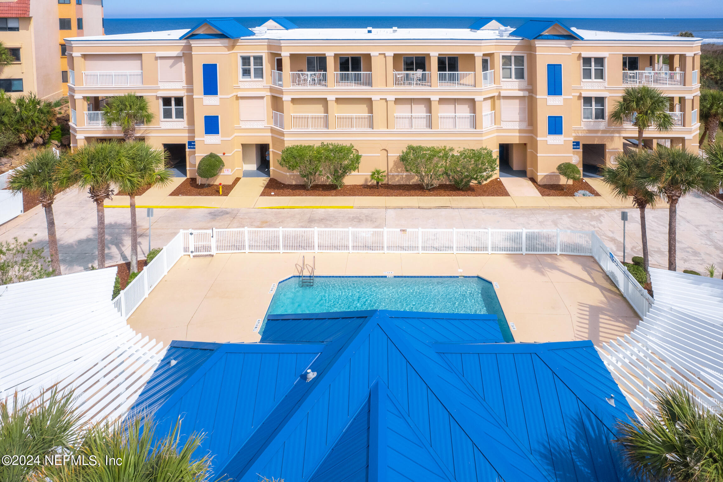 7790 A1A South, Unit 101 St. Augustine, FL 32080 - Photo 75 of 79 a view of building with yard and potted plants