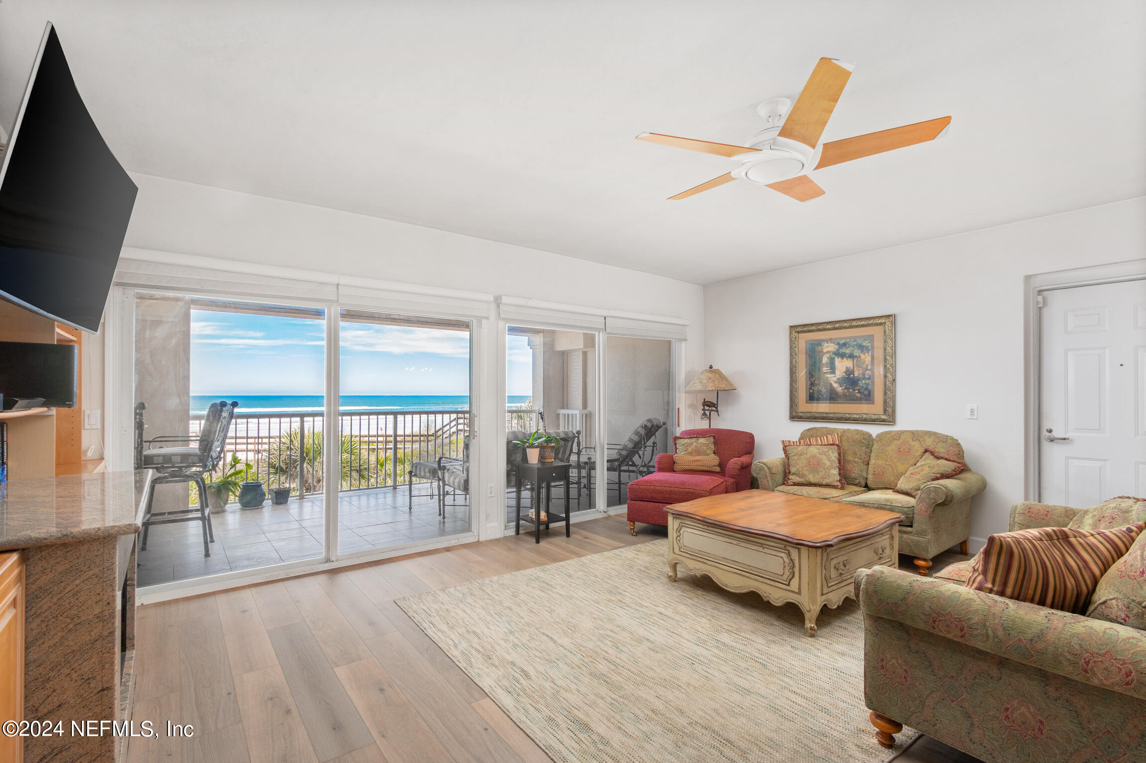 7790 A1A South, Unit 101 St. Augustine, FL 32080 - Photo 10 of 79 a bedroom with furniture and large window