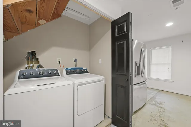 a utility room with dryer and washer
