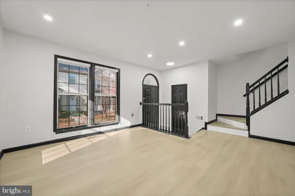 a view of a kitchen with large windows