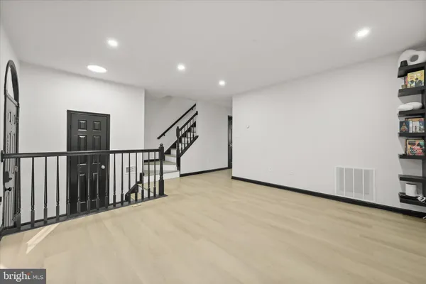 a view of a hall with stairs