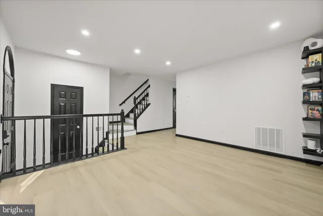 a view of a hall with stairs