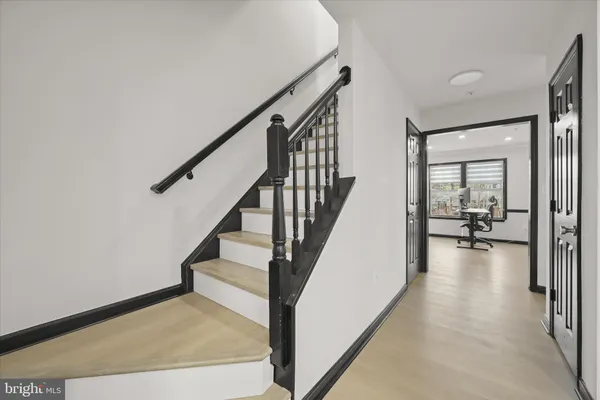 a view of a livingroom with furniture and stairs