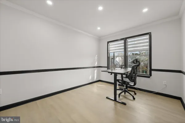 a view of a workspace with furniture