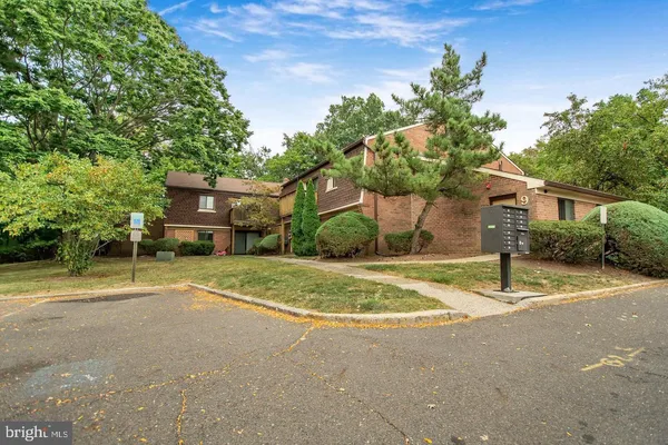 a house with trees in the background