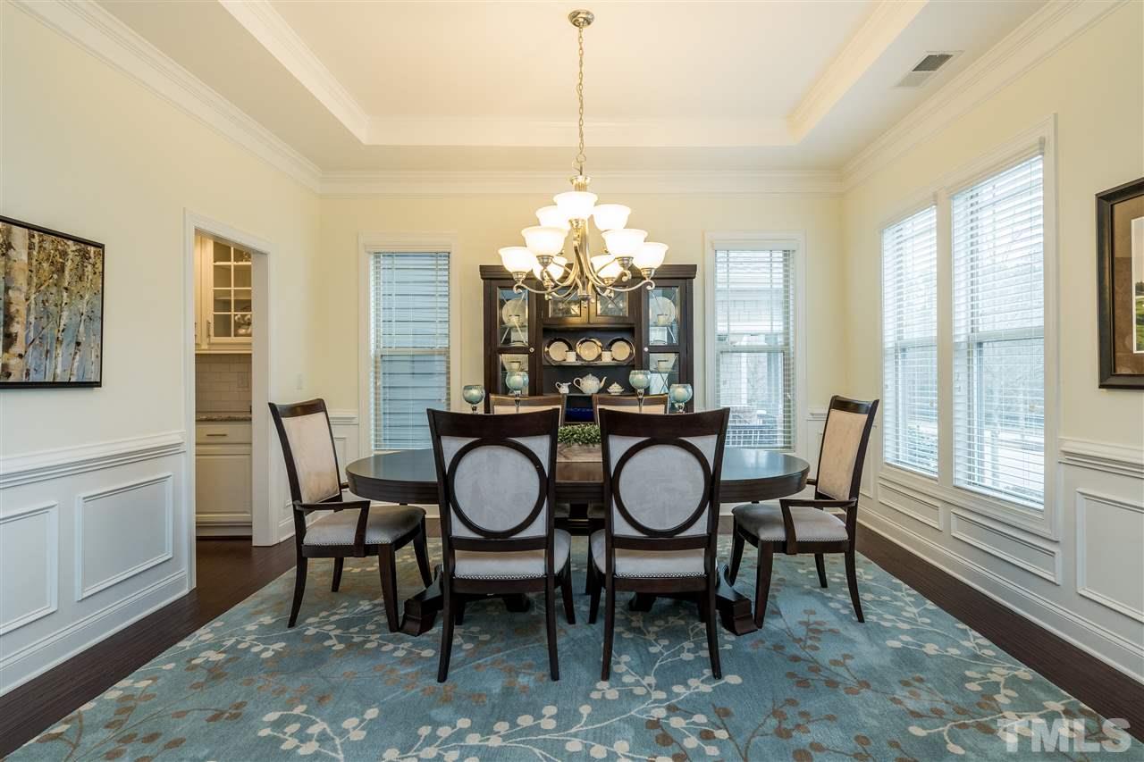 5616 Wade Park Boulevard Raleigh, NC 27607 - Photo 7 of 30 Beautiful and bright dining room with tray ceiling. Conveniently connects to the kitchen with short hallway including butler pantry and pantry.